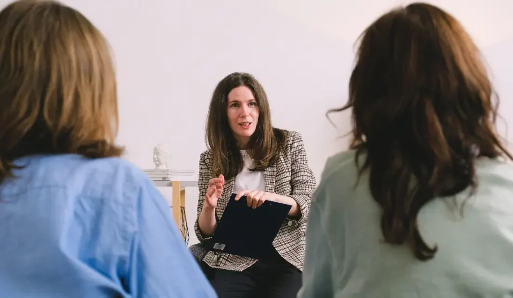 woman discussing details of project with clients