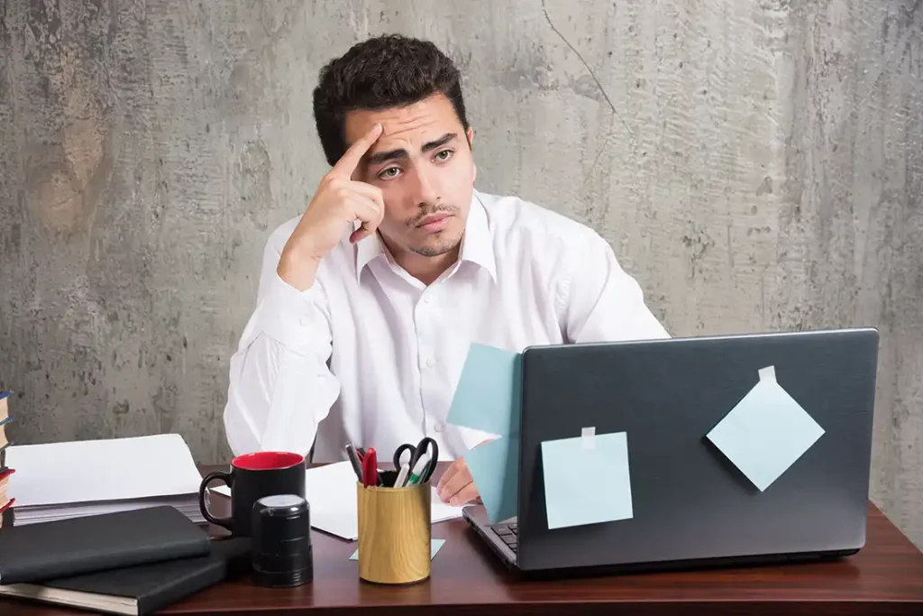office employee watching portable at the office desk copy